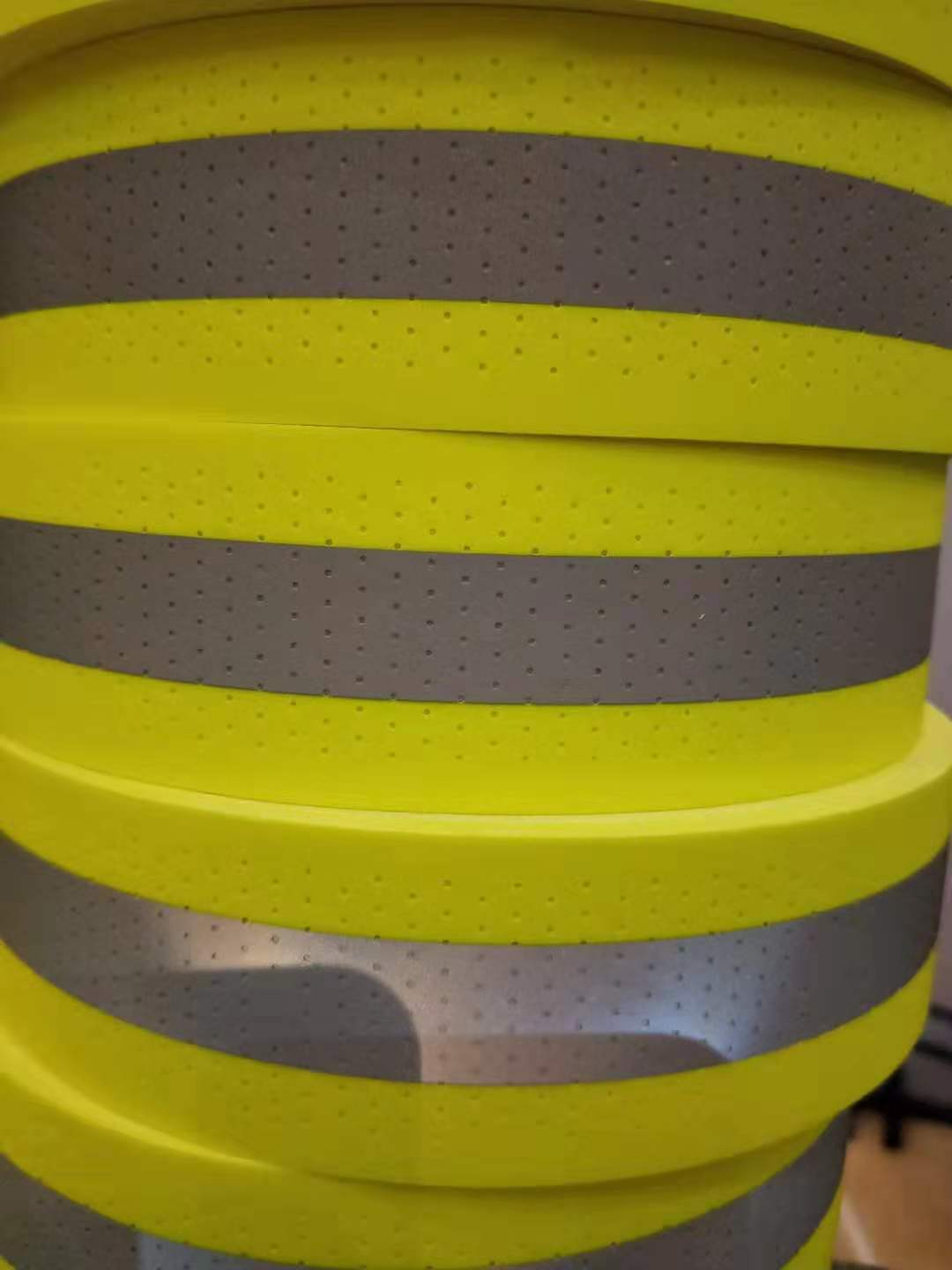 reflective perforated fabric with hole