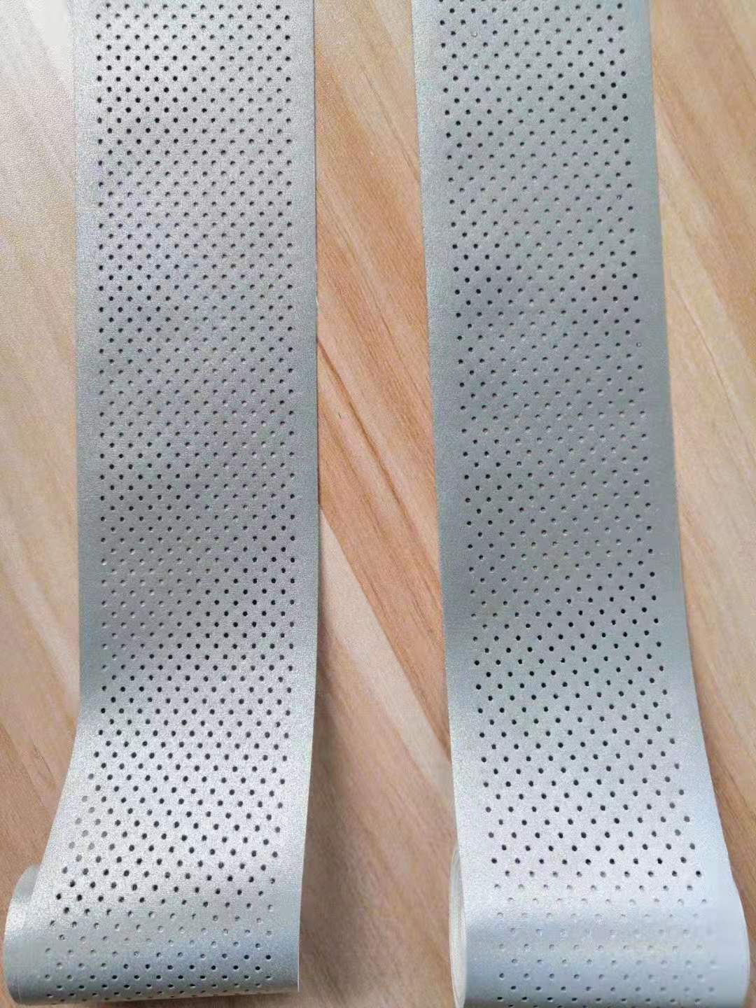 reflective perforated fabric with hole
