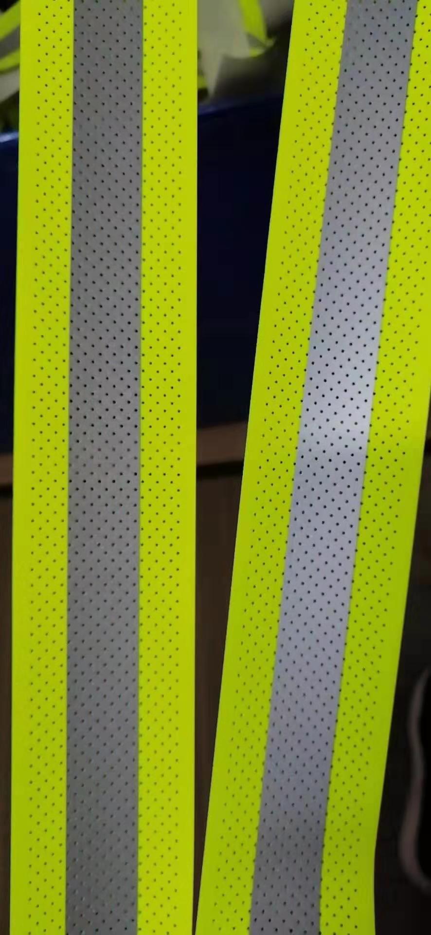 reflective perforated fabric with hole