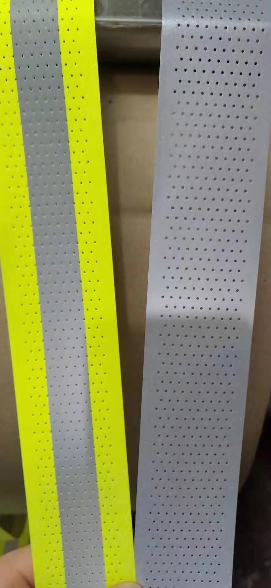 reflective perforated fabric with hole