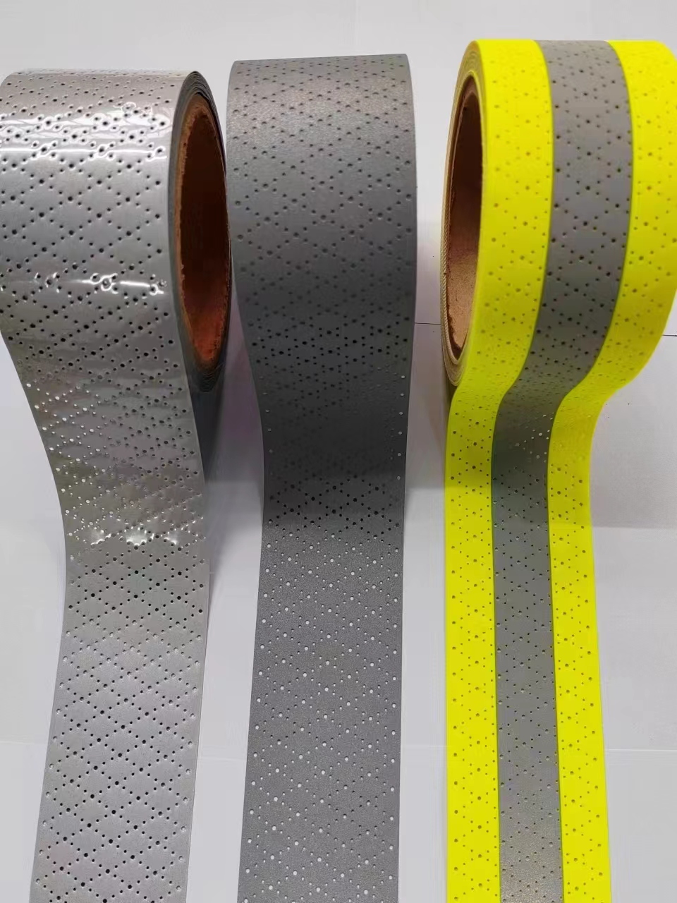 reflective perforated fabric with hole