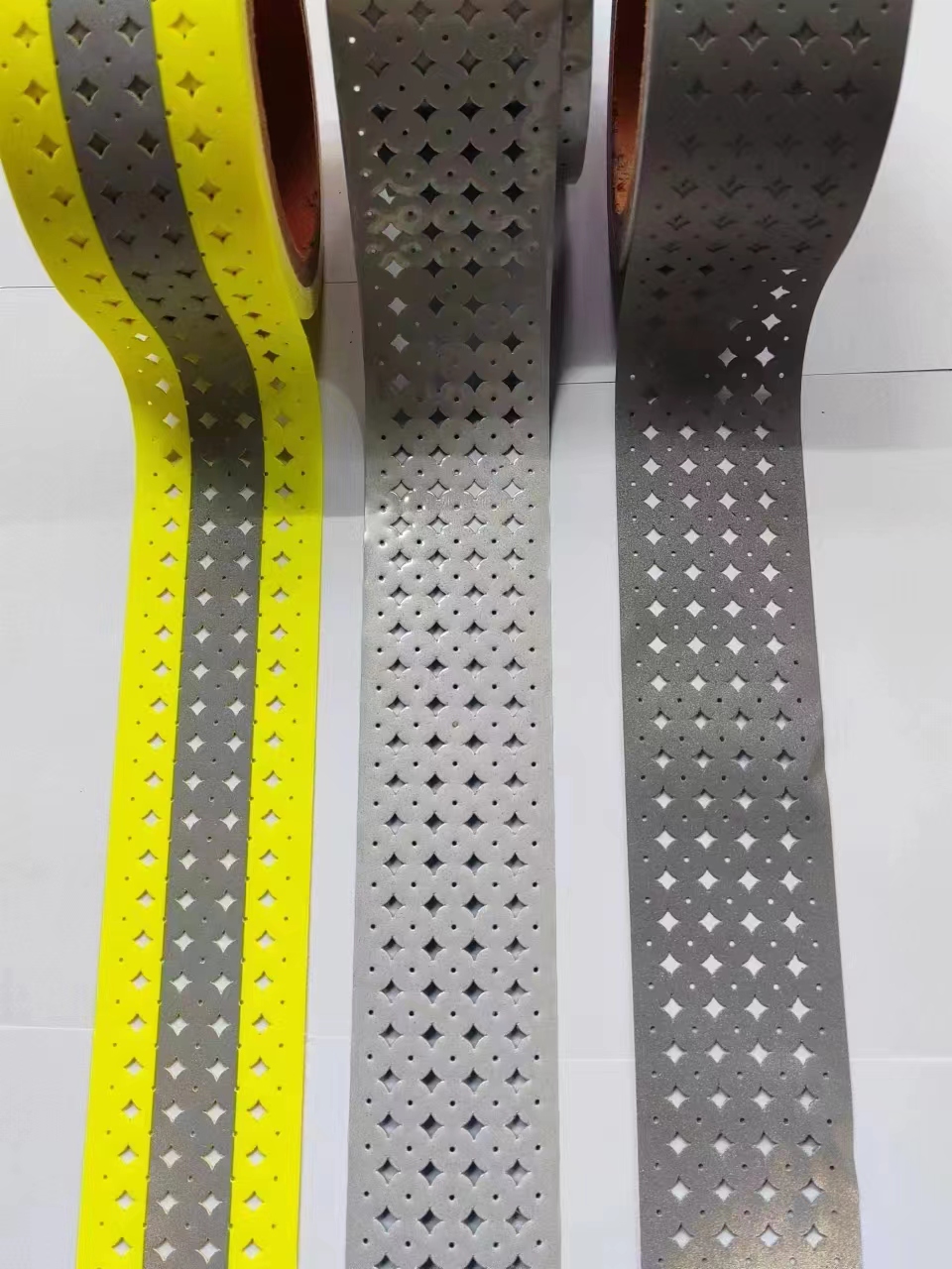 reflective perforated fabric with hole